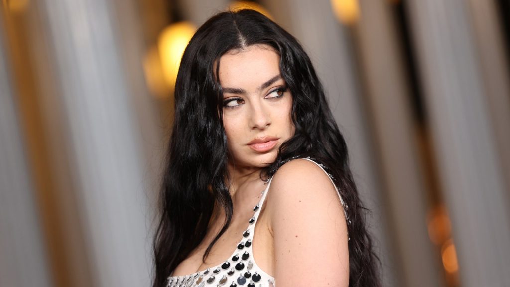 Charli XCX Is an Indie Sleaze Inspiration in a Stained Tank Top, Jorts, and $3,000 Boots