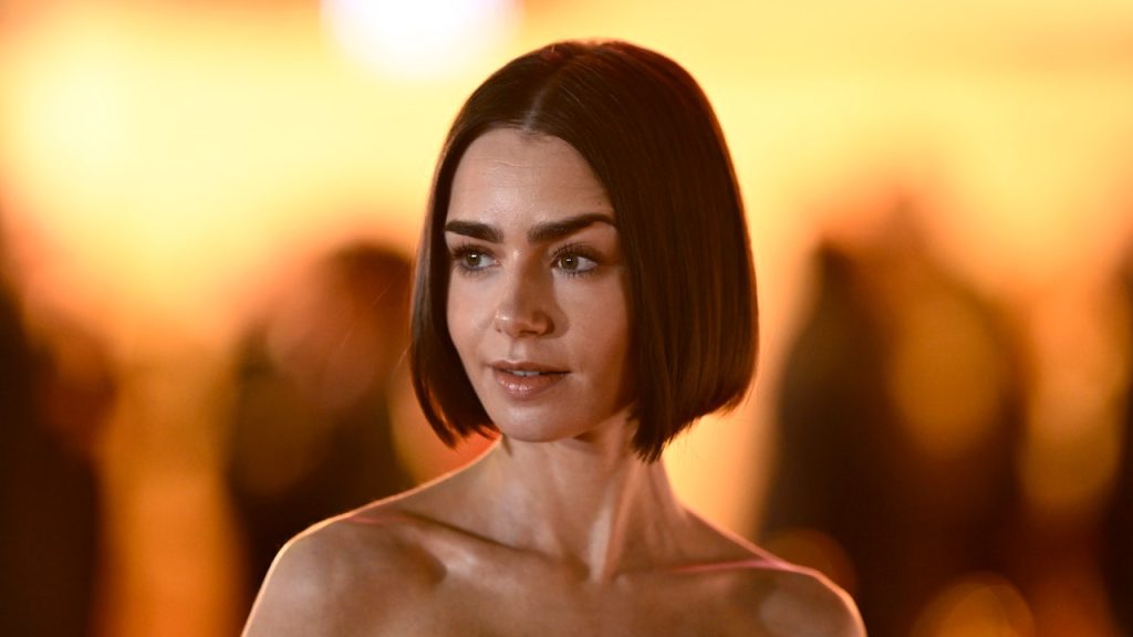 Lily Collins Continues to Shed 'Emily in Paris' in a Sheer Corset Dress With a Dramatic Thigh Slit